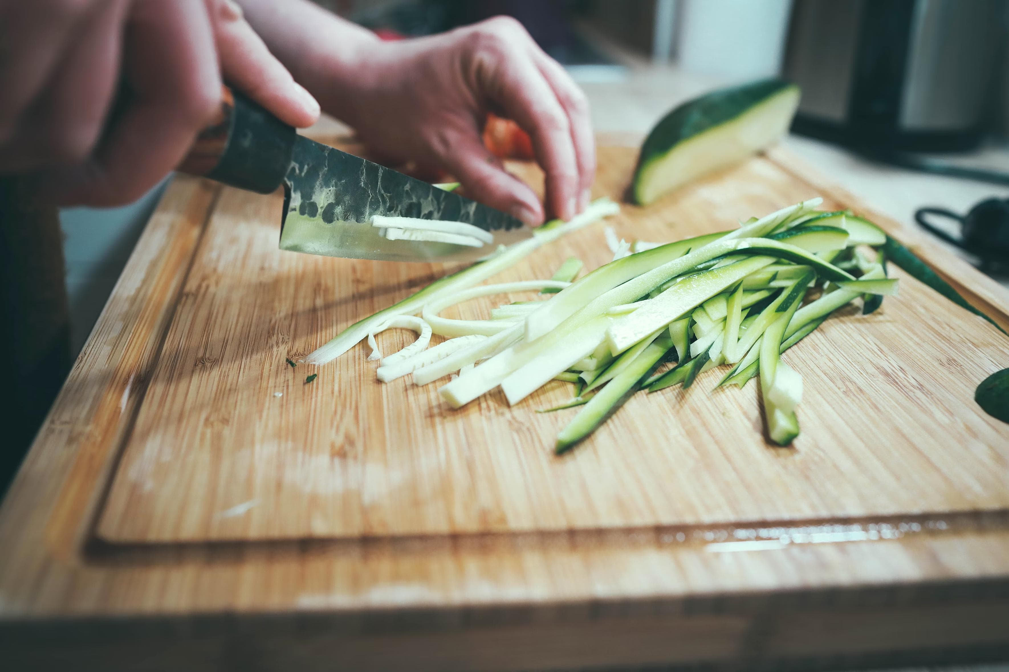 steel utensils on wooden cutting board